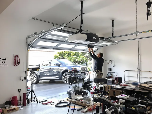 Twinsburg Garage Door Repair specialist installing smart garage door opener system in Twinsburg home