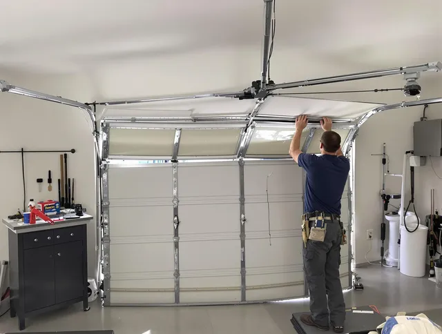 Twinsburg Garage Door Repair specialist performing precise section replacement on Twinsburg garage door